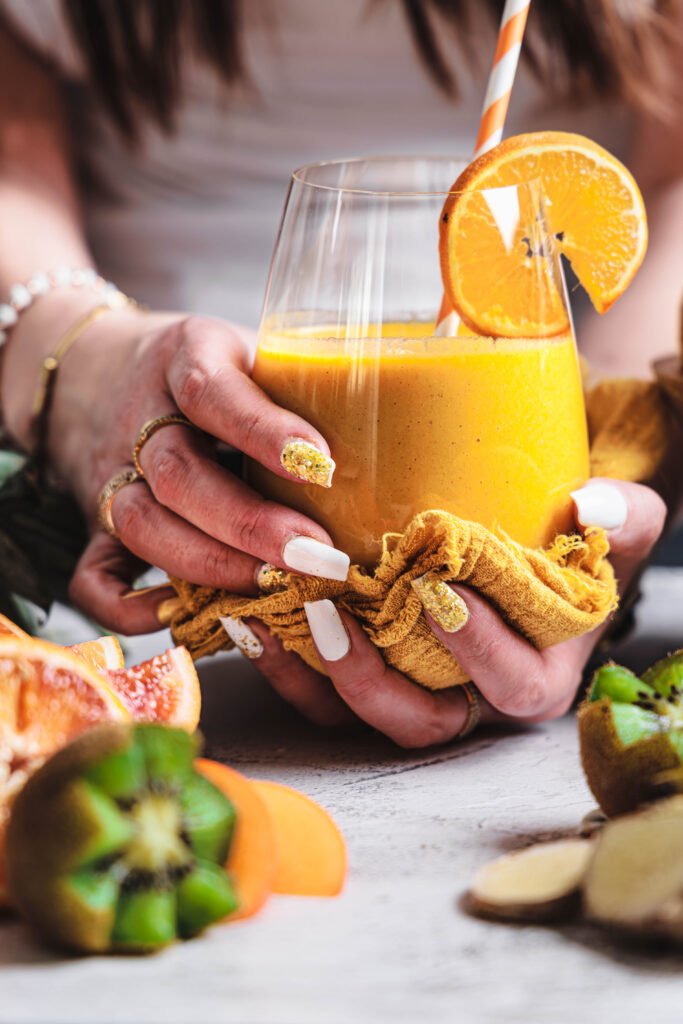 turmeric smoothie in the hand